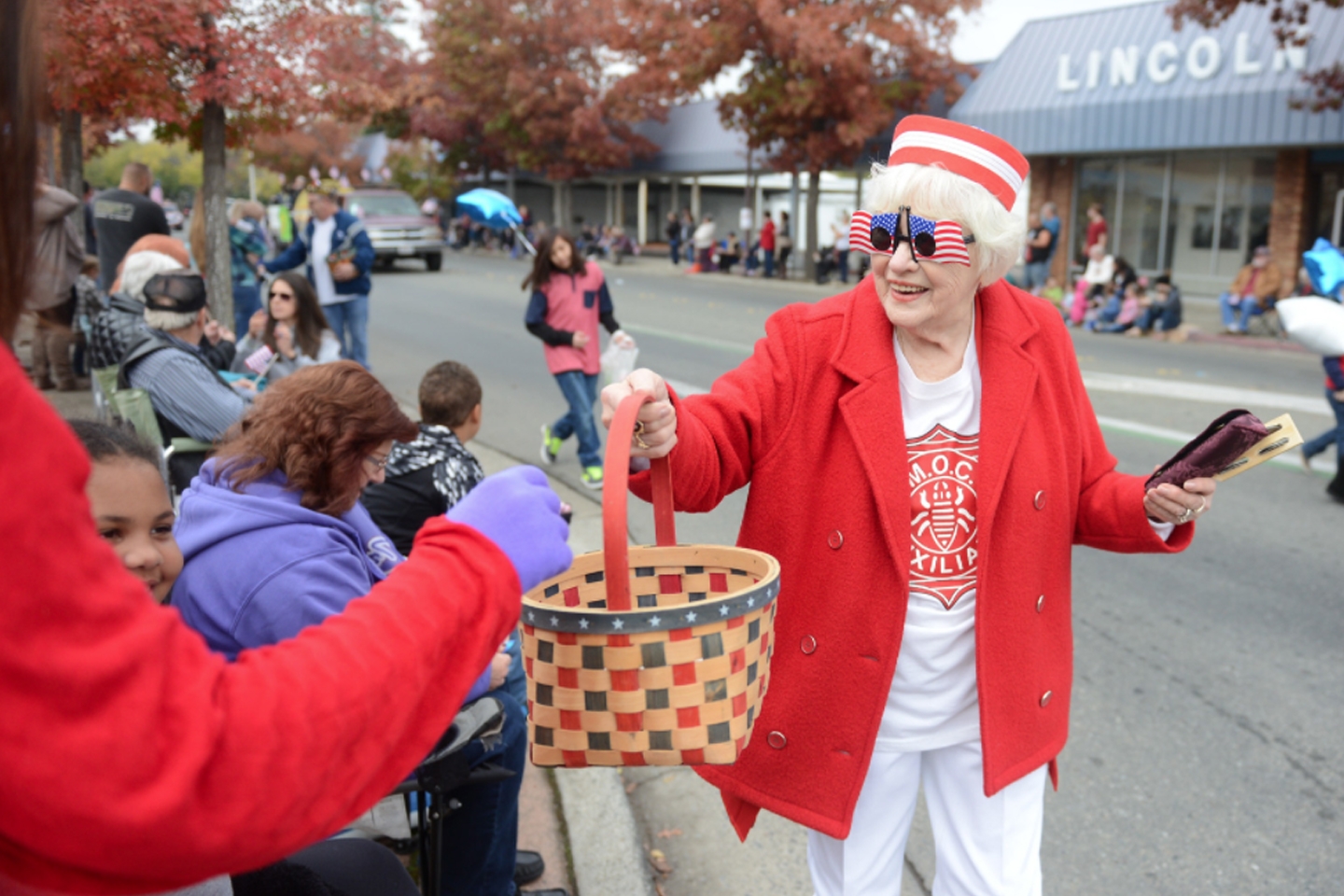 VFW Post 1747 2017/2018 Auxiliary President Sherry Morehouse passes out candy during the 2017 Oroville Veterans Day Parade.